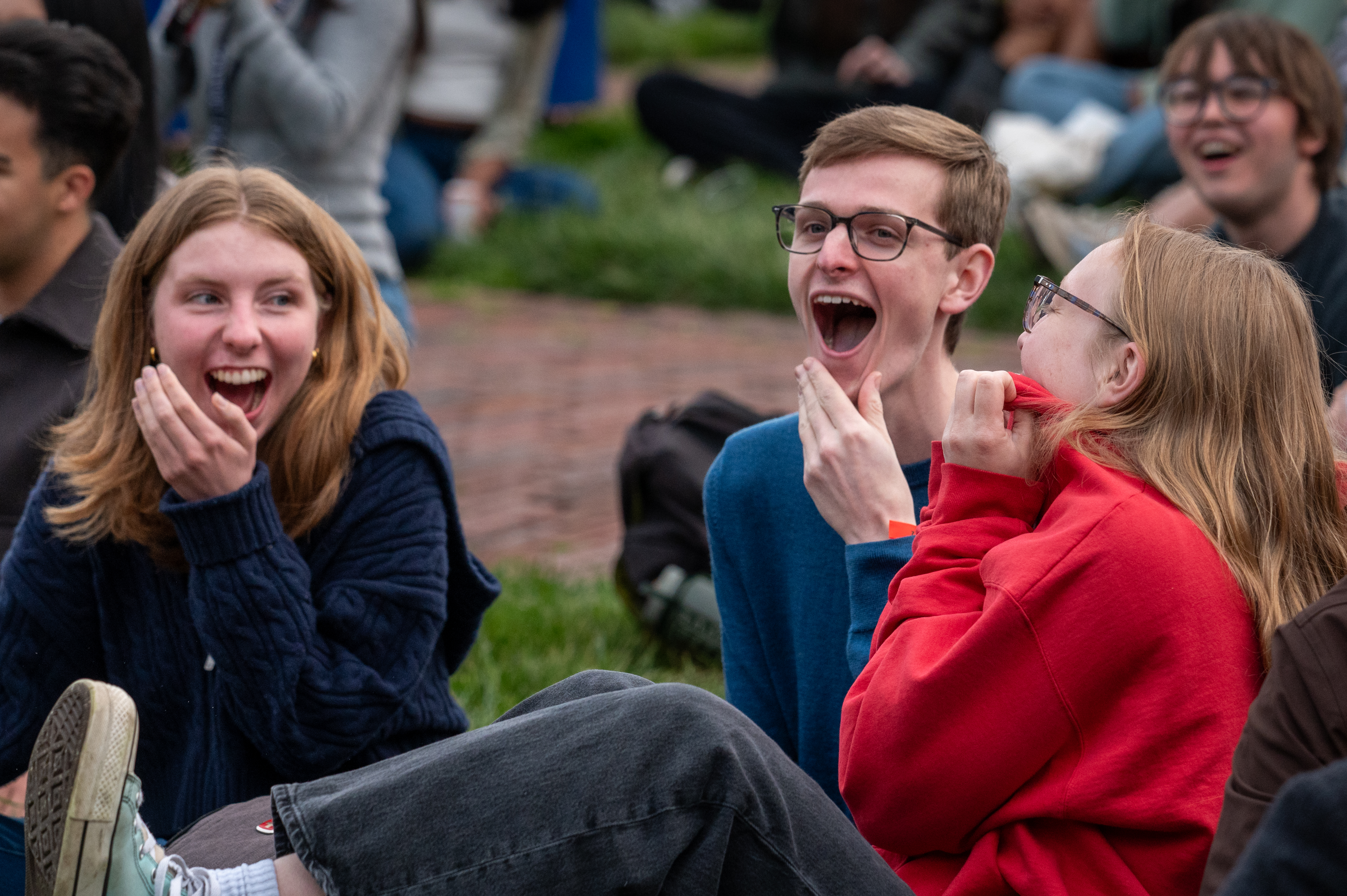 Students reacting to the announcement of the Commencement speaker, Andy Cohen. 